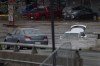 Abandoned cars in a mall parking lot are seen in floodwater following a major rain event in Halifax on Saturday, July 22, 2023. Nova Scotia RCMP say the search continues for four people, including two children, after intense thunderstorms dumped record amounts of rain across the province. THE CANADIAN PRESS/Darren Calabrese