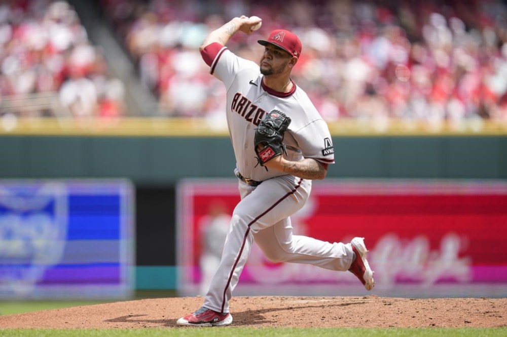Arizona Diamondbacks starting pitcher Jose Ruiz throws against the Cincinnati Reds during the second inning of a baseball game, Sunday, July 23, 2023, in Cincinnati. (AP Photo/Jeff Dean)