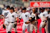 New York Yankees' Harrison Bader, front left, celebrates with teammates after a baseball game against the Kansas City Royals, Sunday, July 23, 2023, in New York. (AP Photo/Frank Franklin II)