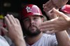 St. Louis Cardinals' Alec Burleson celebrates with teammates after scoring on a one-run single by Dylan Carlson during the sixth inning of a baseball game against the Chicago Cubs in Chicago, Sunday, July 23, 2023. (AP Photo/Nam Y. Huh)