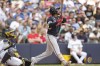 Atlanta Braves' Ozzie Albies watches his three-run home run against the Milwaukee Brewers during the eighth inning of a baseball game, Sunday, July 23, 2023, in Milwaukee. (AP Photo/Jeffrey Phelps)