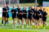 From left, players Melanie Leupholz, Sarai Linder, Lena Lattwein, Svenja Hut, Laura Freigang, Sara Doorsoun, Carolin Simon, Sophia Kleinherne, Chantal Hagel and Felicitas Rauch warm up during training session of the German women's national soccer team in Herzogenaurach, Germany, Monday, June 3, 2023. The women's soccer world championships take place in Australia and New Zealand from July 20, 2023 until August 20, 2023. (Daniel Loeb/dpa/dpa via AP)