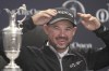 United States' Brian Harman gestures as he speaks at a press conference next to the iconic Claret Jug trophy after winning the British Open Golf Championships at the Royal Liverpool Golf Club in Hoylake, England, Sunday, July 23, 2023. (AP Photo/Kin Cheung)