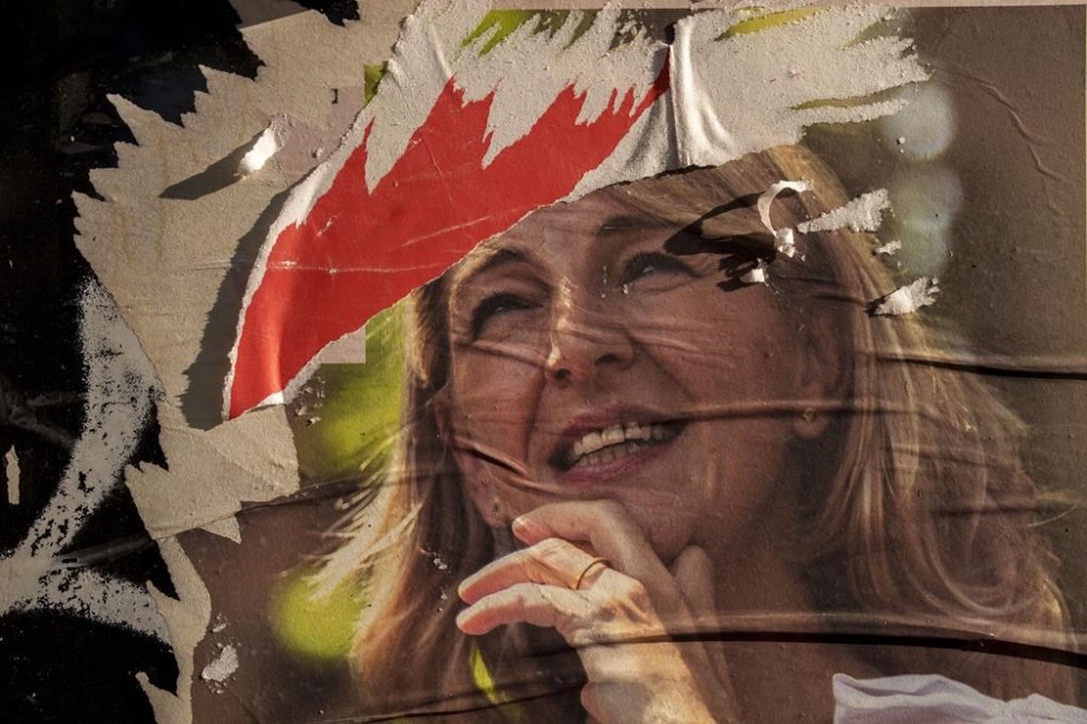 A partially torn electoral poster of Yolanda Diaz, leader of the left-wing coalition Sumar, in Madrid, Spain, Monday, July 24, 2023. Spain may be facing political gridlock and possibly a new election, but a national ballot produced one result that will be welcomed across the capitals of Europe: a far-right party aiming to get its hands on the levers of power was thwarted. (AP Photo/Manu Fernandez)