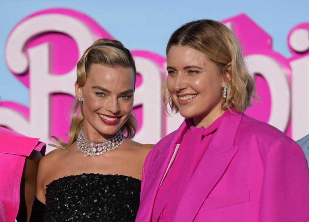 Margot Robbie, left, and writer/director/executive producer Greta Gerwig arrive at the premiere of