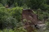 CN Rail says a major washout has halted traffic on part of its main line in Nova Scotia after torrential rain and flooding struck the province over the weekend. Workers with CN Rail assess the damage to a washed-out rail line outside of Truro, N.S. on Sunday, July 23, 2023. THE CANADIAN PRESS/Darren Calabrese