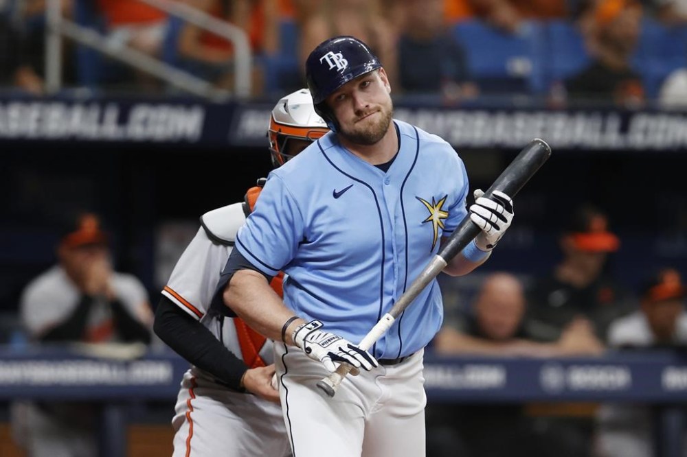 Tampa Bay Rays' Luke Raley walks back to the dugout after striking out against the Baltimore Orioles during the ninth inning of a baseball game, Sunday, July 23, 2023, in St. Petersburg, Fla. (AP Photo/Scott Audette)