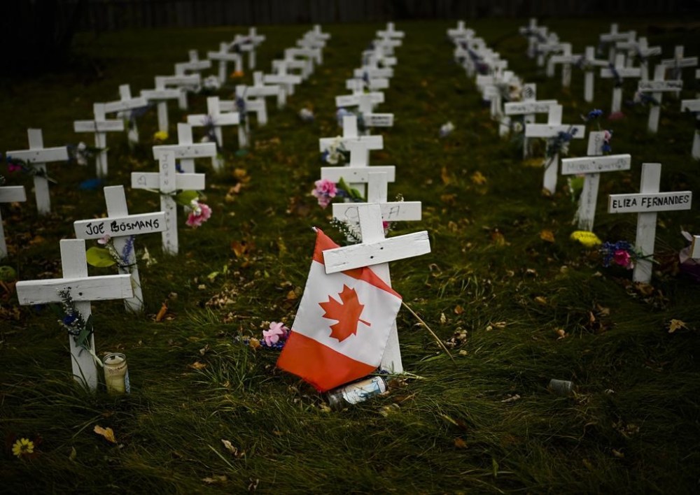 A new series published in the BMJ medical journal is calling for an independent inquiry into Canada's COVID-19 response. Crosses are displayed in memory of the elderly who died from COVID-19 at the Camilla Care Community facility during the COVID-19 pandemic in Mississauga, Ont., Thursday, Nov. 19, 2020. THE CANADIAN PRESS/Nathan Denette