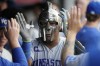 Kansas City Royals' Salvador Perez celebrates in the dugout following his home run in the sixth inning of a baseball game against the Cleveland Guardians, Monday, July 24, 2023, in Cleveland. (AP Photo/Sue Ogrocki)