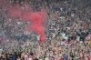 FILE - Croatia supporters light flares during the Nations League final soccer match between Croatia and Spain at De Kuip stadium in Rotterdam, Netherlands, Sunday, June 18, 2023. Croatia’s soccer federation has been fined $165,000 by UEFA for offensive chants and disorder by fans at the Nations League Finals last month. UEFA also says Croatia fans cannot be sold tickets for the team’s next competitive away game. (AP Photo/Martin Meissner, File)