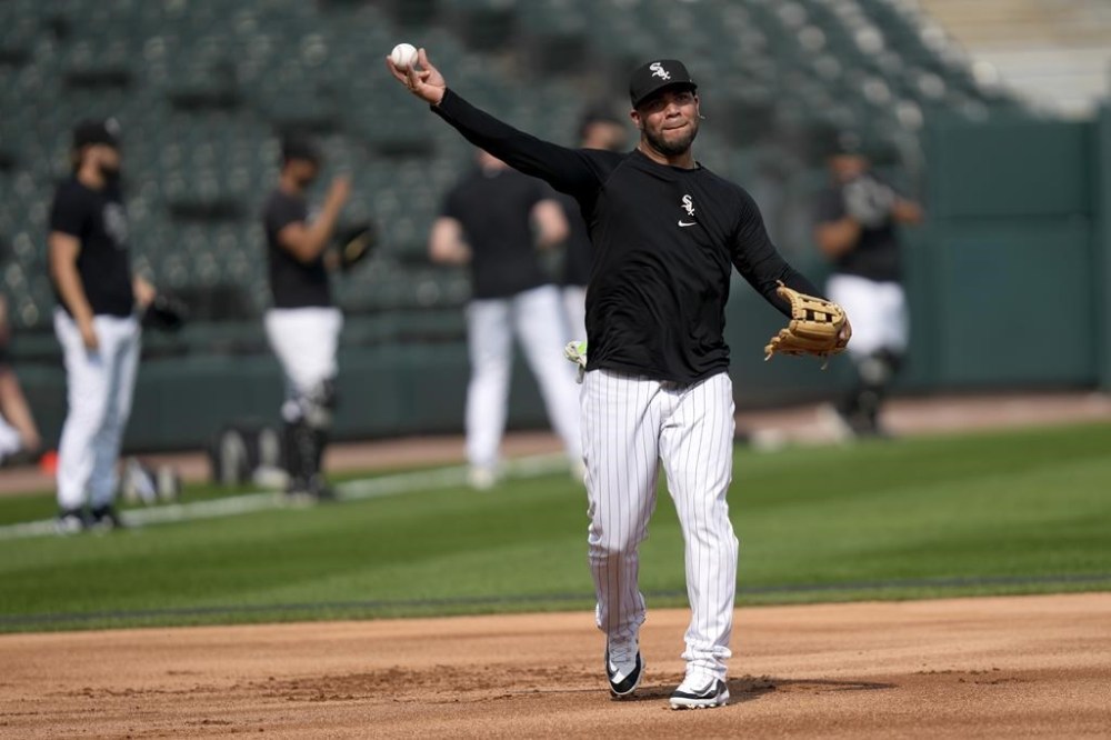Chicago White Sox third baseman Yoán Moncada throws during infield practice before the team's baseball game against the Chicago Cubs, Tuesday, July 25, 2023, in Chicago. Moncada returned to the team after an injury rehabilitation assignment, reinstating him from the 10-day injured list. (AP Photo/Charles Rex Arbogast)