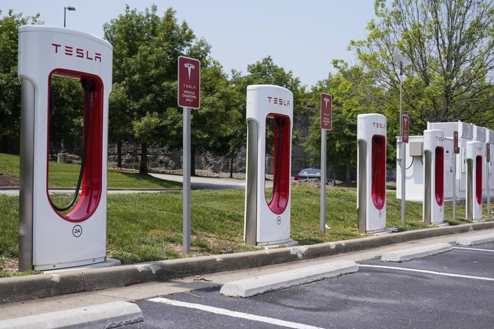 FILE - A Tesla electronic vehicle charging station is seen Thursday, May 25, 2023, in Nashville, Tenn. The Biden administration is making available $20 billion from a federal