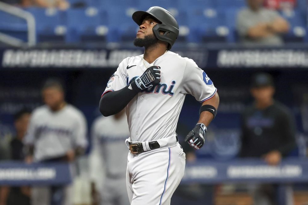 Miami Marlins' Bryan De La Cruz celebrates his home run against the Tampa Bay Rays during the fifth inning of a baseball game Wednesday, July 26, 2023, in St. Petersburg, Fla. (AP Photo/Mike Carlson)