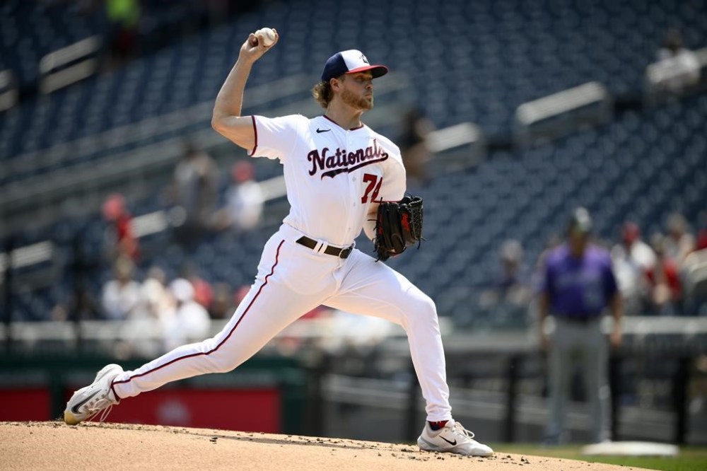 Washington Nationals starting pitcher Jake Irvin throws during the second inning of a baseball game against the Colorado Rockies, Wednesday, July 26, 2023, in Washington. (AP Photo/Nick Wass)