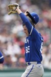 Kansas City Royals relief pitcher Dylan Coleman (65) stretches in the sixthinning of a baseball game against the Cleveland Guardians, Wednesday, July 26, 2023, in Cleveland. (AP Photo/Sue Ogrocki)