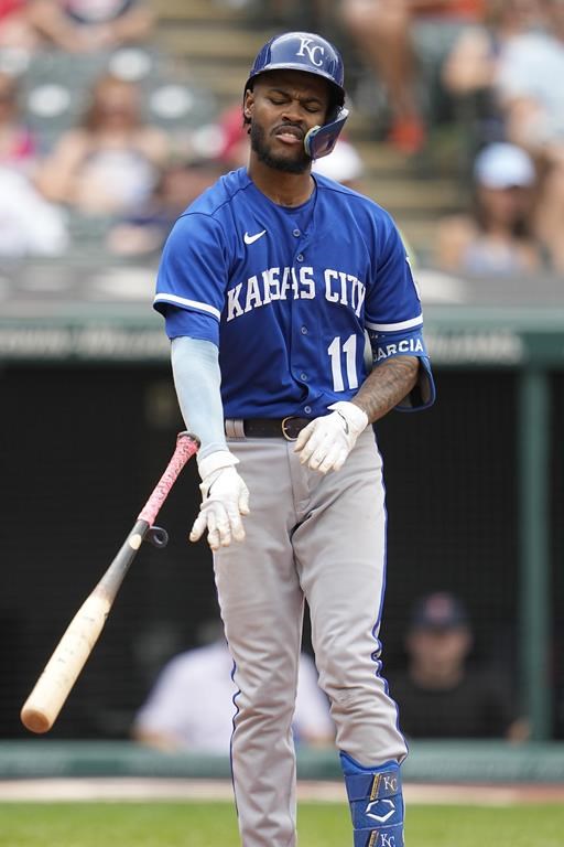Kansas City Royals' Maikel Garcia (11) throws his bat after lining out to first base in the sixth inning of a baseball game against the Cleveland Guardians, Wednesday, July 26, 2023, in Cleveland. (AP Photo/Sue Ogrocki)