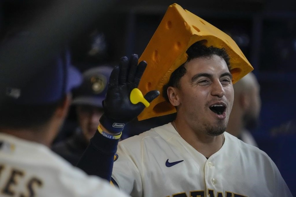 Milwaukee Brewers' Tyrone Taylor reacts after hitting a two-run home run during the seventh inning of a baseball game against the Cincinnati Reds Wednesday, July 26, 2023, in Milwaukee. (AP Photo/Morry Gash)