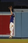 Los Angeles Dodgers center fielder James Outman (33) catches a line out from Toronto Blue Jays' Vladimir Guerrero Jr. during the seventh inning of a baseball game against the Toronto Blue Jays, Tuesday, July 25, 2023, in Los Angeles. (AP Photo/Ryan Sun)
