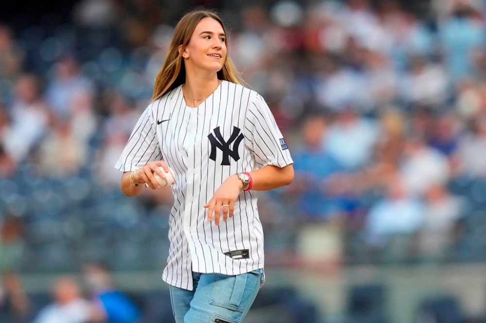 New York Liberty's Sabrina Ionescu prepares to throw out a ceremonial first pitch before a baseball game between the New York Yankees and the New York Mets Wednesday, July 26, 2023, in New York. (AP Photo/Frank Franklin II)