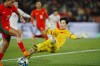 Vietnam's goalkeeper Thi Kim Thanh Tran and Portugal's Kika Nazareth compete for the ball during the Women's World Cup Group E soccer match between Portugal and Vietnam in Hamilton, New Zealand, Thursday, July 27, 2023. (AP Photo/Abbie Parr)