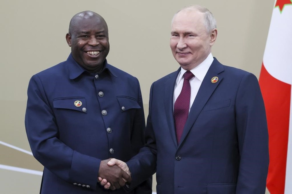 Russian President Vladimir Putin, right, and President of the Republic of Burundi Evariste Ndayishimiye meet on the sidelines of the Russia Africa Summit in St. Petersburg, Russia, Thursday, July 27, 2023. (Mikhail Metzel/TASS Host Photo Agency Pool Photo via AP)