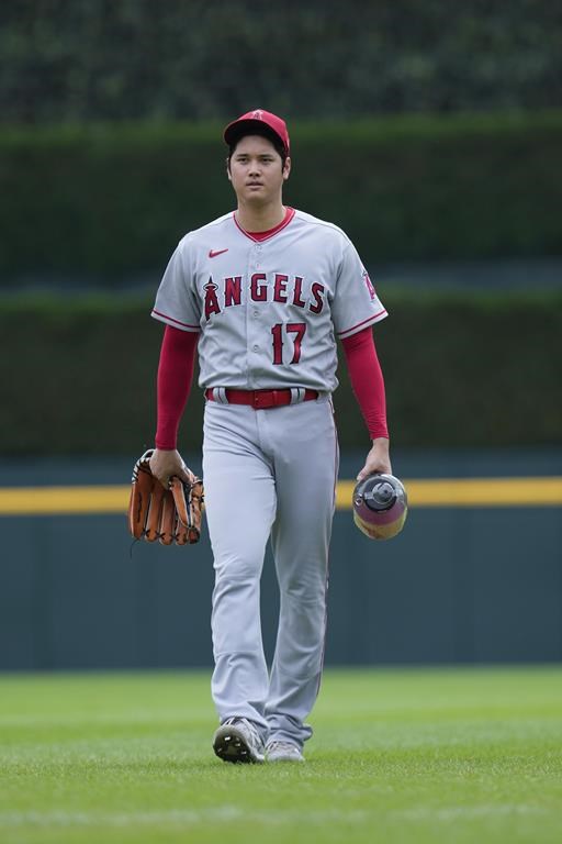 Los Angeles Angels pitcher Shohei Ohtani (17) walks to the dugout after warming up before the first baseball game against the Detroit Tigers of a doubleheader, Thursday, July 27, 2023, in Detroit. (AP Photo/Paul Sancya)