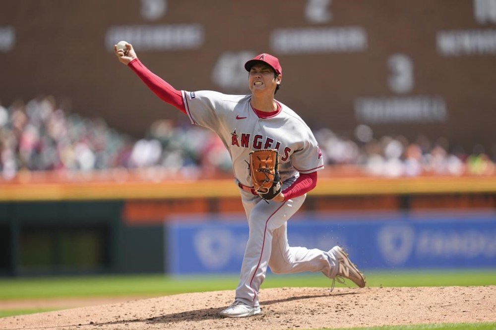 Los Angeles Angels pitcher Shohei Ohtani throws against the Detroit Tigers in the fourth inning during the first baseball game of a doubleheader, Thursday, July 27, 2023, in Detroit. (AP Photo/Paul Sancya)