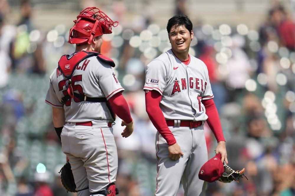Los Angeles Angels pitcher Shohei Ohtani celebrates with catcher Chad Wallach (35) after the final out in the ninth inning during the first baseball game of a doubleheader, Thursday, July 27, 2023, in Detroit. (AP Photo/Paul Sancya)
