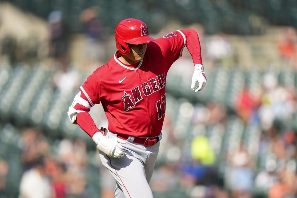 Los Angeles Angels' Shohei Ohtani stretches as he rounds the bases after his home run against the Detroit Tigers in the fourth inning during the second baseball game of a doubleheader, Thursday, July 27, 2023, in Detroit. (AP Photo/Paul Sancya)