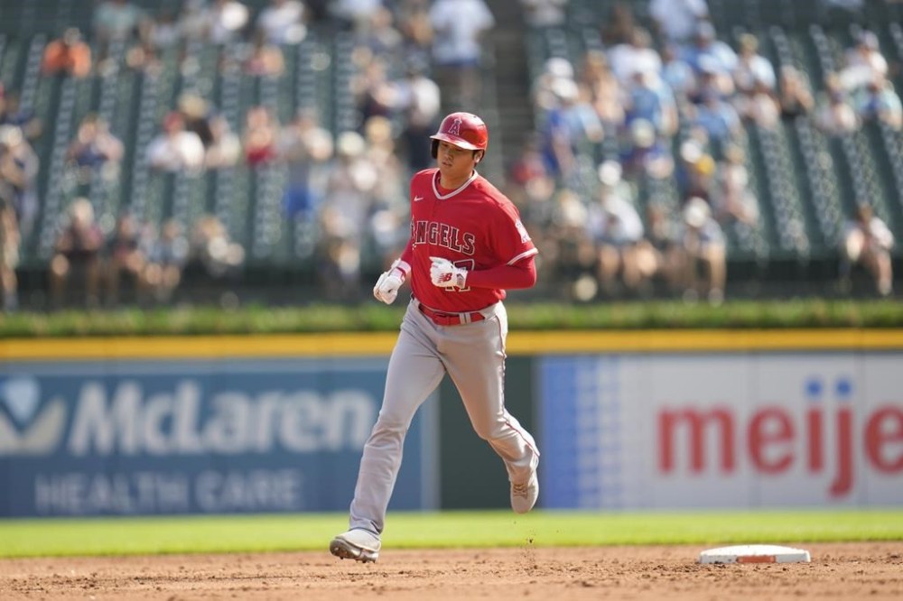 Los Angeles Angels' Shohei Ohtani rounds second base on his two-run home run against the Detroit Tigers in the second inning during the second baseball game of a doubleheader, Thursday, July 27, 2023, in Detroit. (AP Photo/Paul Sancya)