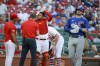 A trainer tends to St. Louis Cardinals catcher Willson Contreras after he was hit by bat of Chicago Cubs' Ian Happ, right, during the first inning of a baseball game Thursday, July 27, 2023, in St. Louis. (AP Photo/Scott Kane)