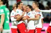 Christine Sinclair (left to right), Adriana Leon, Jessie Fleming and Quinn celebrate a second half goal by Leon against Ireland during their Group B match at the FIFA Women's World Cup in Perth, Australia, Wednesday, July 26, 2023. The Canadian women's soccer team confirmed Friday it has reached an interim labour agreement with Canada Soccer covering compensation for 2023, including prize money from the ongoing FIFA Women's World Cup. THE CANADIAN PRESS/James Worsfold