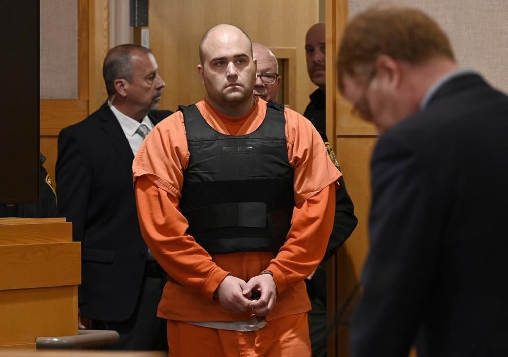 FILE - Joseph Eaton, the suspect in a shooting spree, enters the court for his arraignment in West Bath, Maine, April 20, 2023. Eaton was arraigned on numerous charges including four counts of murder on Friday, July 28, in West Bath. Eaton is charged with killing his parents and their friends in April in Bowdoin, Maine, and also faces attempted murder charges for firing at cars on I-295 in Yarmouth, Maine. (Shawn Patrick Ouellette/Portland Press Herald via AP, File)