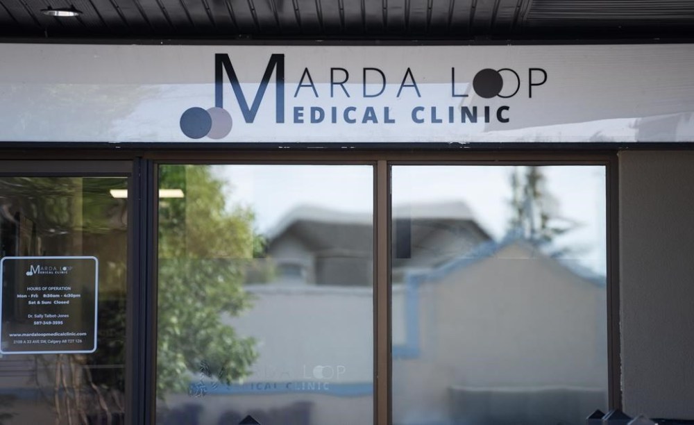 The Marda Loop Medical Clinic is seen in Calgary, Wednesday, July 26, 2023. Danielle Smith says if a Calgary medical clinic begins charging a fee for faster access to a family doctor, it will be shut down, fined or have medicare payments from the province withheld. THE CANADIAN PRESS/Todd Korol