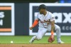 Detroit Tigers second baseman Andy Ibanez (77) makes a fielding error on a ball hit by Miami Marlins' Joey Wendle, who was safe at first during the second inning of a baseball game Friday, July 28, 2023, in Miami. (AP Photo/Marta Lavandier)