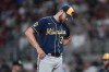 Milwaukee Brewers starting pitcher Adrian Houser waits on the mound for manager Craig Counsell to relieve him in the fifth inning of a baseball game against the Atlanta Braves, Friday, July 28, 2023, in Atlanta. (AP Photo/John Bazemore)
