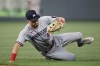 Minnesota Twins second baseman Edouard Julien fields a ground ball by Kansas City Royals' Kyle Isbel for an out during the seventh inning of a baseball game in Kansas City, Mo., Friday, July 28, 2023. (AP Photo/Colin E. Braley)