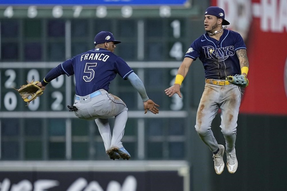 Tampa Bay Rays shortstop Wander Franco (5) and center fielder Jose Siri (22) celebrate after a baseball game against the Houston Astros, Friday, July 28, 2023, in Houston. (AP Photo/Kevin M. Cox)