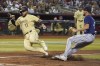 Arizona Diamondbacks' Jose Herrera (11) scores on a wild pitch as Seattle Mariners pitcher Matt Brash tries to make a play during the seventh inning during a baseball game Friday, July 28, 2023, in Phoenix. (AP Photo/Darryl Webb)