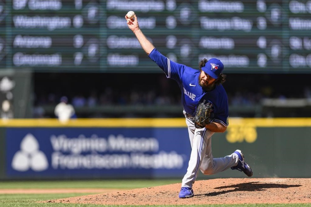 Toronto Blue Jays relief pitcher Jordan Romano throws during the ninth inning of a baseball game against the Seattle Mariners, Sunday, July 23, 2023, in Seattle. THE CANADIAN PRESS/AP-Caean Couto