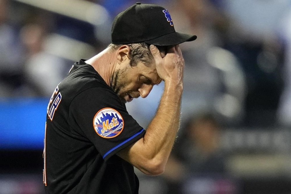 FILE - New York Mets starting pitcher Max Scherzer reacts after New York Yankees' Jake Bauers hit an RBI single during the fourth inning of a baseball game Tuesday, June 13, 2023, in New York. (AP Photo/Frank Franklin II, FIle)