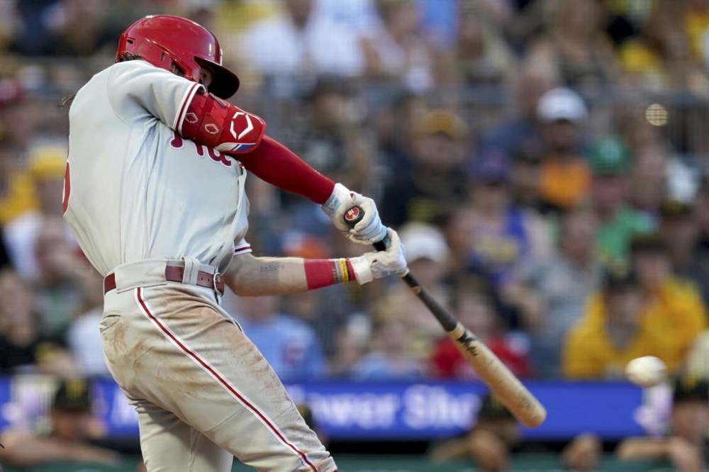 Philadelphia Phillies' Brandon Marsh hits an RBI double against the Pittsburgh Pirates during the fourth inning of a baseball game in Pittsburgh, Saturday, July 29, 2023. (AP Photo/Matt Freed)