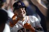 Houston Astros' Yainer Diaz is congratulated in the dugout after his two-run home run against the Tampa Bay Rays during the second inning of a baseball game Saturday, July 29, 2023, in Houston. (AP Photo/Kevin M. Cox)
