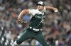 Colorado Rockies relief pitcher Brad Hand works against the Oakland Athletics in the ninth inning of a baseball game Saturday, July 29, 2023, in Denver. (AP Photo/David Zalubowski)