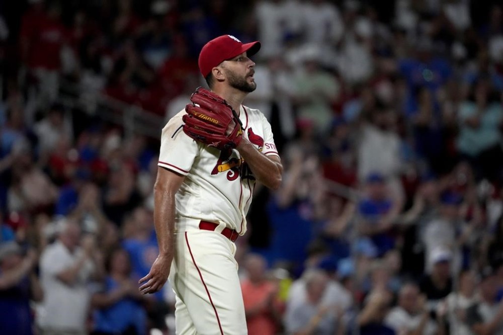 St. Louis Cardinals starting pitcher Adam Wainwright reacts after giving up a two-run home run to Chicago Cubs' Ian Happ during the third inning of a baseball game Saturday, July 29, 2023, in St. Louis. (AP Photo/Jeff Roberson)