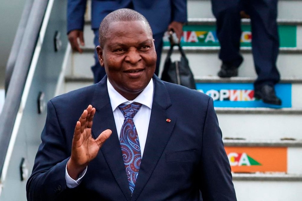FILE - President of the Central African Republic Faustin-Archange Touadera waves to journalists upon his arrival at Pulkovo International Airport to participate the Russia Africa Summit in St. Petersburg, Russia, on July 26, 2023. The Central African Republic went to the polls Sunday July 30, 2023 in a highly anticipated vote on a new constitution, which would remove presidential term limits. (Staniclav Krasilnikov/TASS Host Photo Agency Pool Photo via AP, File)