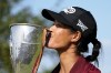 France's Celine Boutier kisses her trophy after winning the Evian Championship women's golf tournament in Evian, eastern France, Sunday, July 30, 2023. (AP Photo/Lewis Joly)