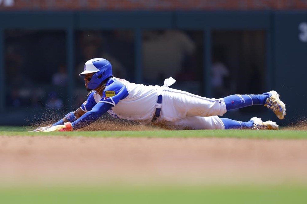 Atlanta Braves' Ronald Acuna Jr. steals second base during the third inning of a baseball game against the Milwaukee Brewers, Sunday, July 30, 2023, in Atlanta. (AP Photo/Todd Kirkland)