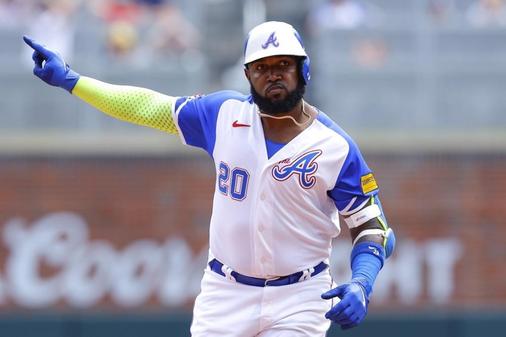 Atlanta Braves' Marcell Ozuna reacts after hitting a home run during the sixth inning of a baseball game against the Milwaukee Brewers, Sunday, July 30, 2023, in Atlanta. (AP Photo/Todd Kirkland)