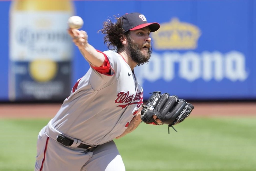 Washington Nationals pitcher Trevor Williams delivers against the New York Mets in the first inning of a baseball game, Sunday, July 30, 2023, in New York. (AP Photo/Mary Altaffer)